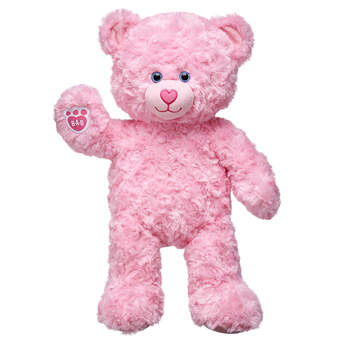 Pink Cuddles Teddy Bear is a soft and sweet furry friend. This pink teddy bear has swirly fur and an adorable heart-shaped nosed with light blue eyes.