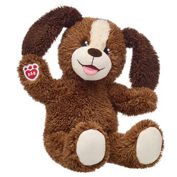 brown plush stuffed animal dog sitting